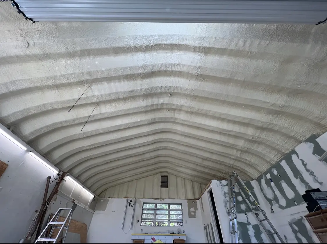 Spray polyurethane foam applied to the underside of a metal roof deck in Lake Grove